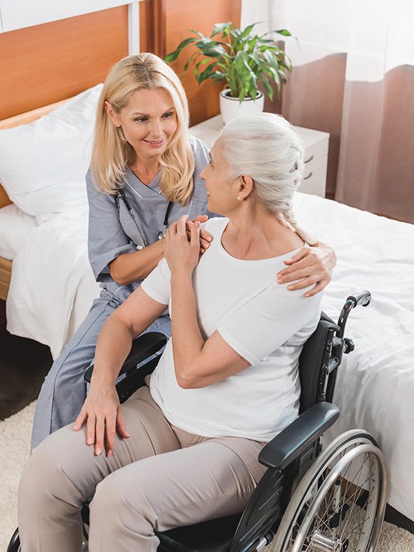 Caregiver and Elderly Woman in wheelchair