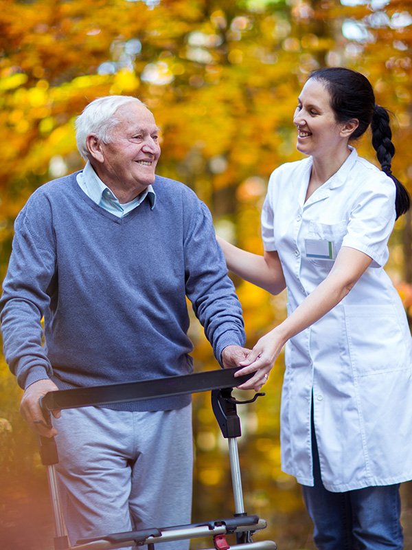 Elderly man with caregiver