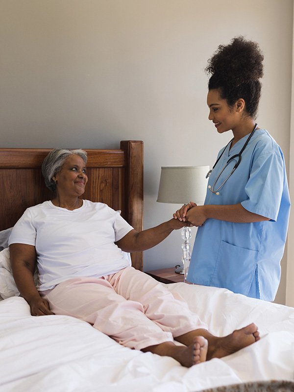 Elderly woman with caregiver