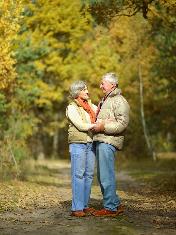 Elderly couple in woods