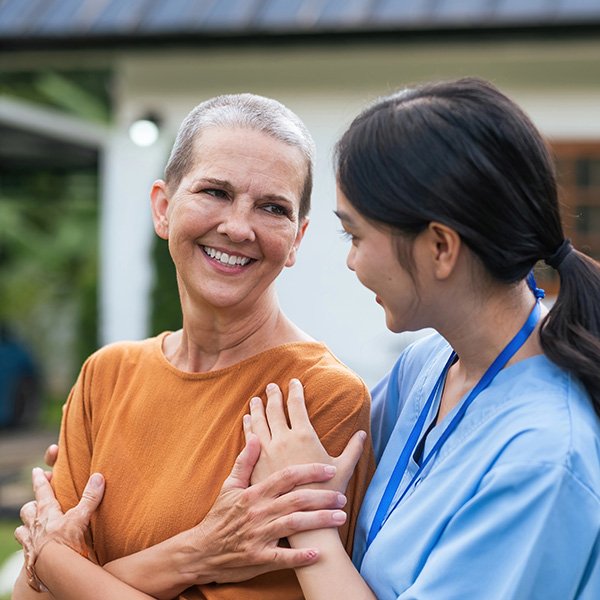 Elderly woman with caregiver