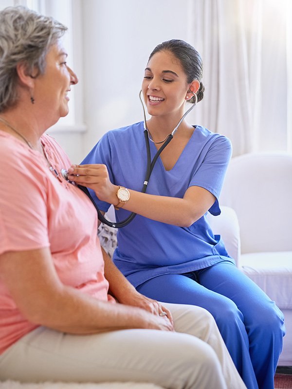 Elderly woman with nurse