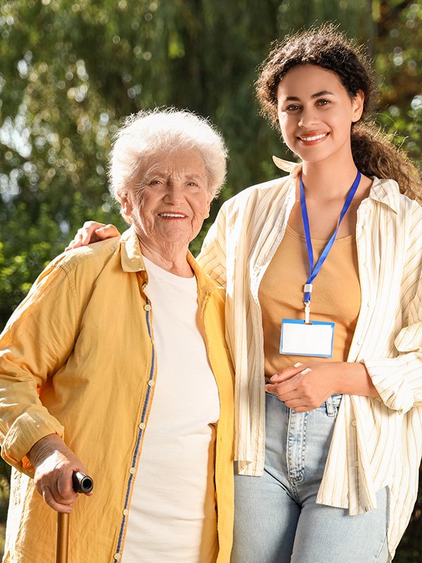 Elderly lady and caregiver