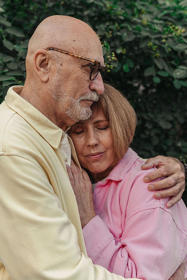 Elderly couple embracing